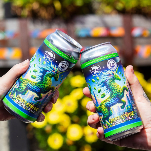 Two hands holding cans of First Stride IPA in a cheers, with yellow flowers in the background.
