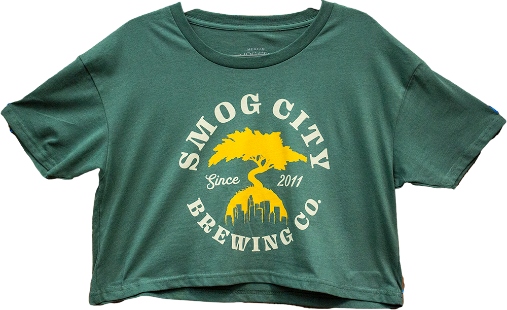 Green crop top shirt with yellow Smog City Brewing bonsai tree and LA skyline logo. Smog City Brewing Co. Since 2011d 