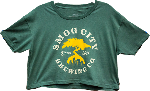 Green crop top shirt with yellow Smog City Brewing bonsai tree and LA skyline logo. Smog City Brewing Co. Since 2011d 
